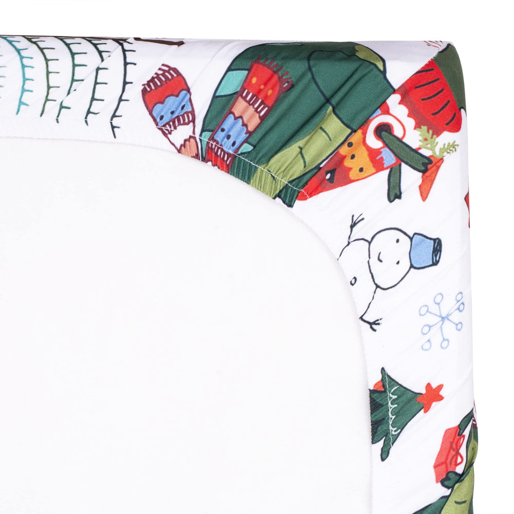 UOMNY nursery decor with Christmas dinosaur theme creates a playful bedtime scene.