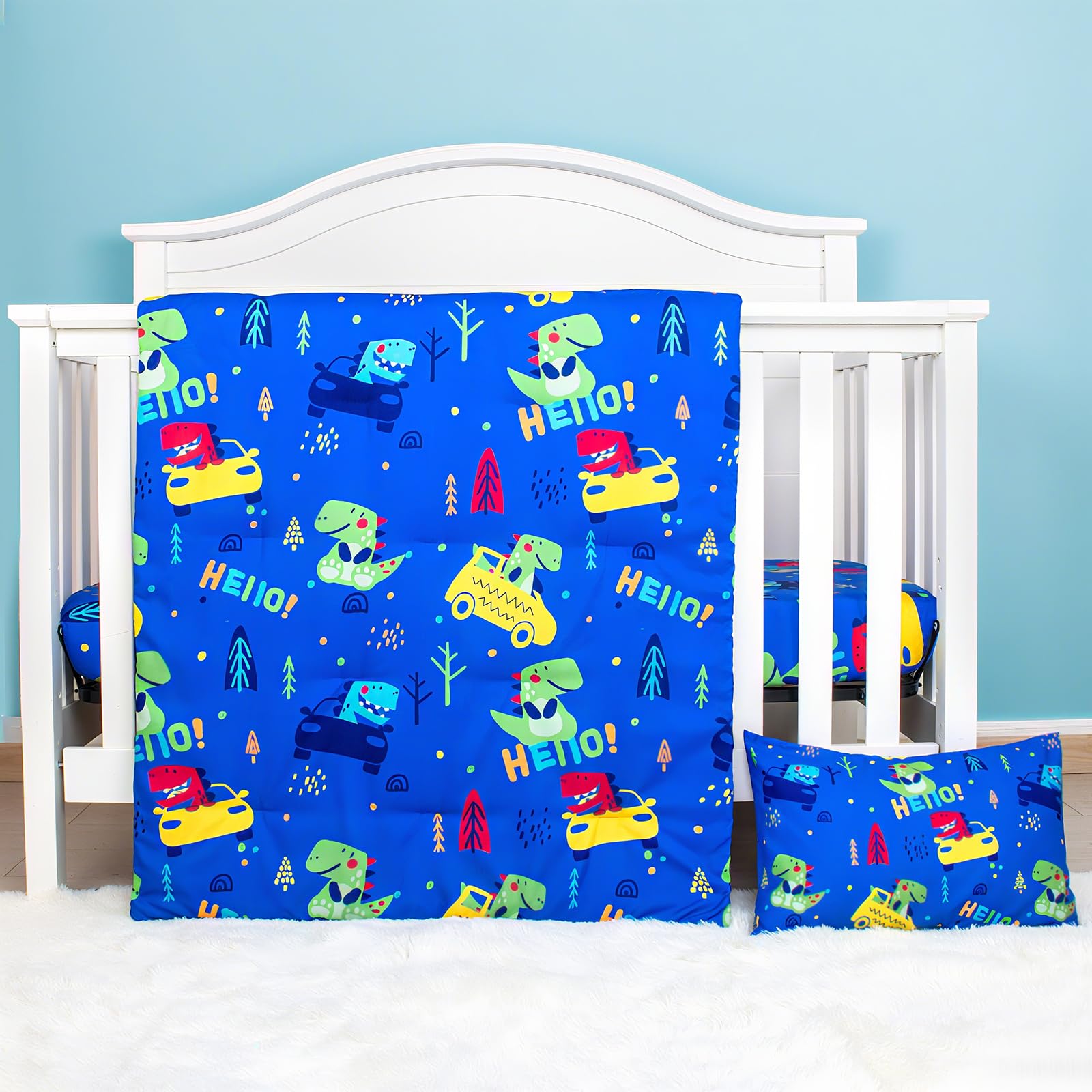 UOMNY dinosaur crib bedding comforter shows cozy fabric for nap time.