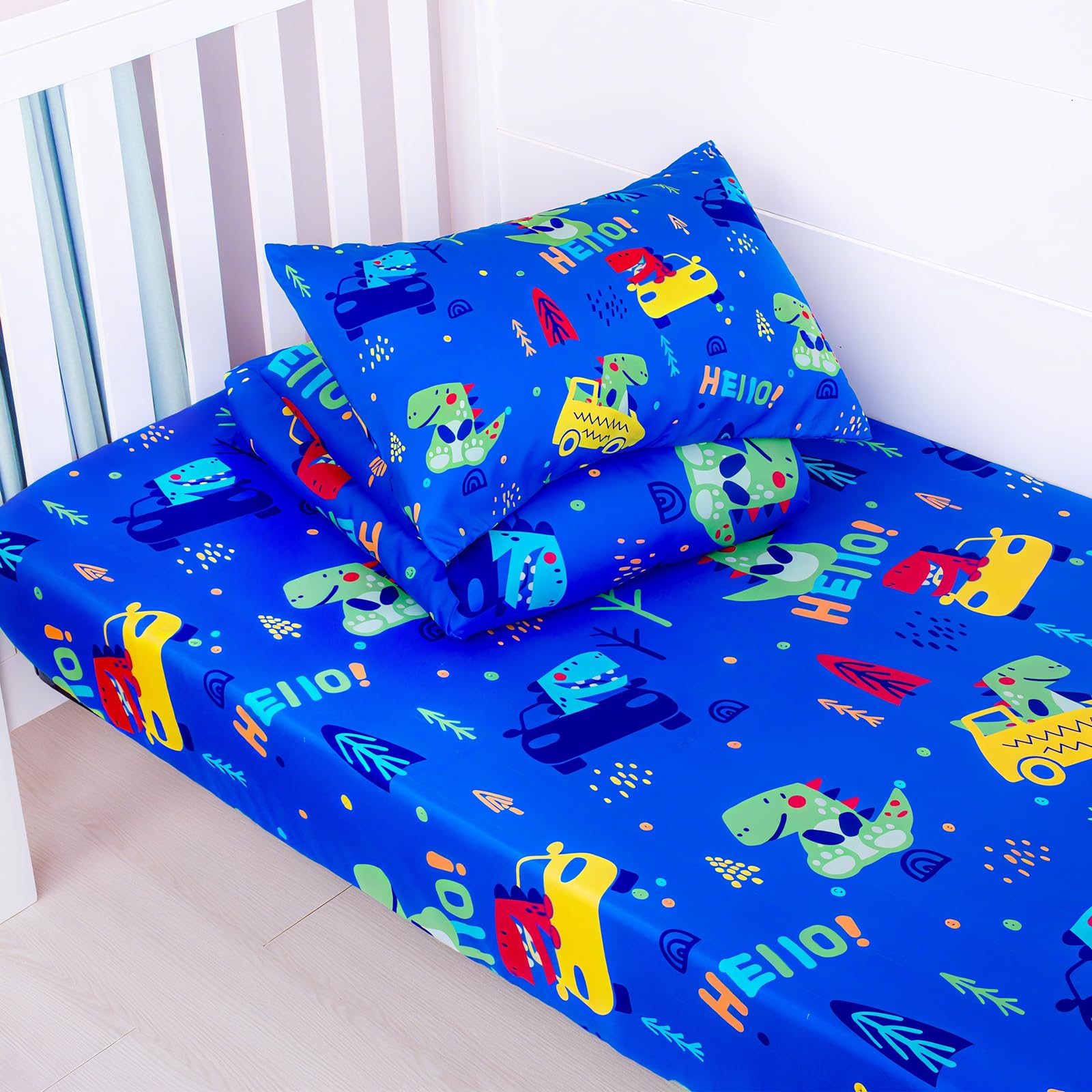 UOMNY dinosaur print quilt adds playful nursery decor.