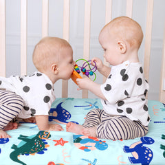 UOMNY wash care crib sheet guide helps maintain color and softness