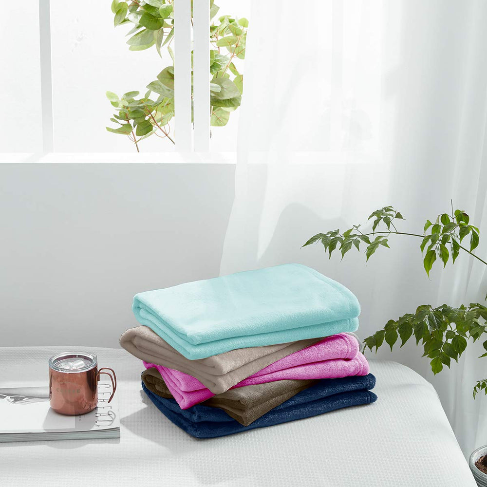 UOZZI Bedding blanket in crib, purple, soft layer for restful naps.
