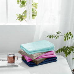 UOZZI Bedding blanket in crib, purple, soft layer for restful naps.