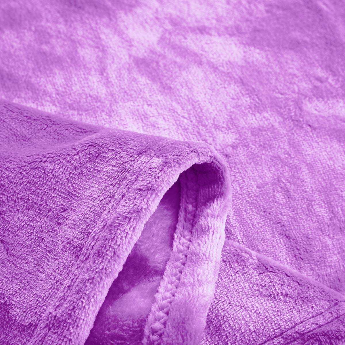 UOZZI Bedding fabric close-up, soft microfiber surface for gentle touch.