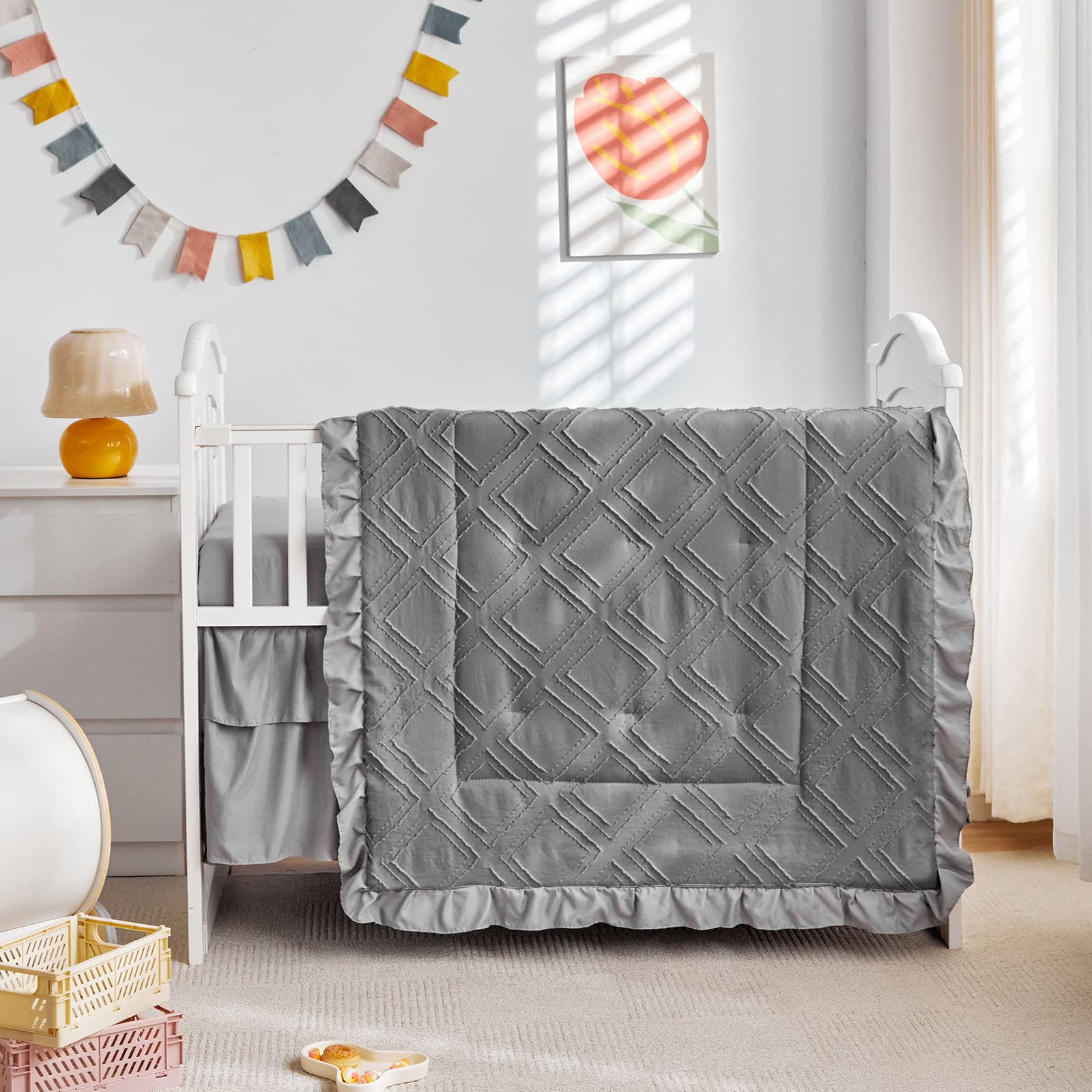 Boho quilt stitch detail on UOZZI BEDDING gray crib set