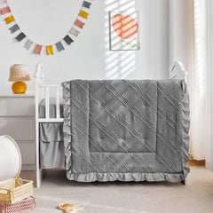 Boho quilt stitch detail on UOZZI BEDDING gray crib set