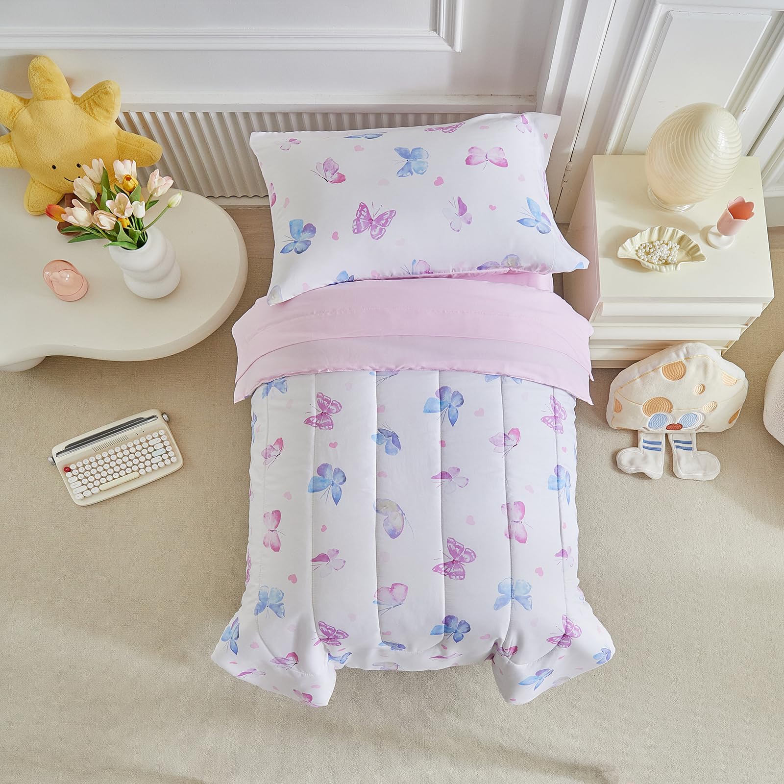 UOZZI BEDDING butterfly toddler fitted sheet anchors the set securely.