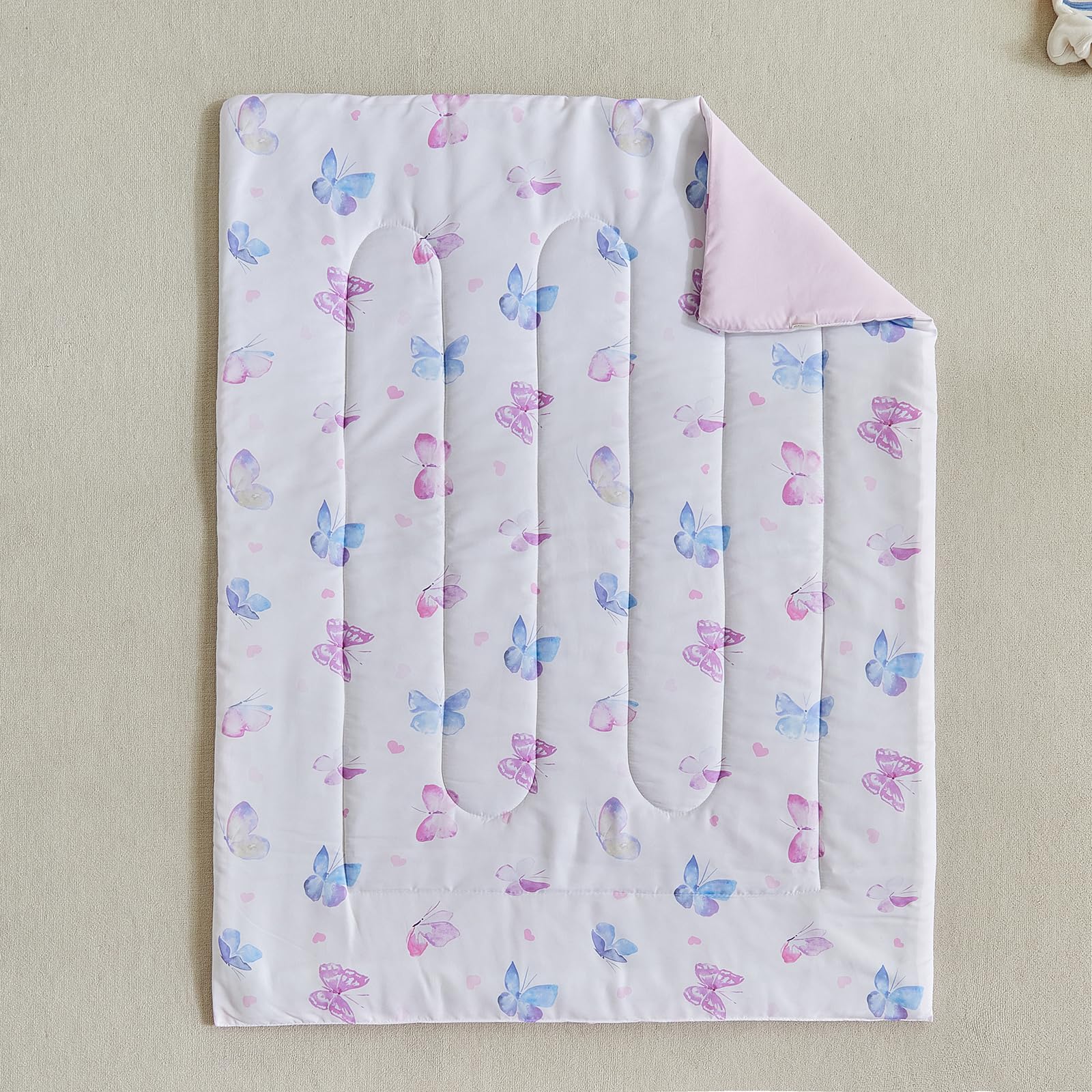 UOZZI BEDDING butterfly design on white base enhances nursery aesthetic.