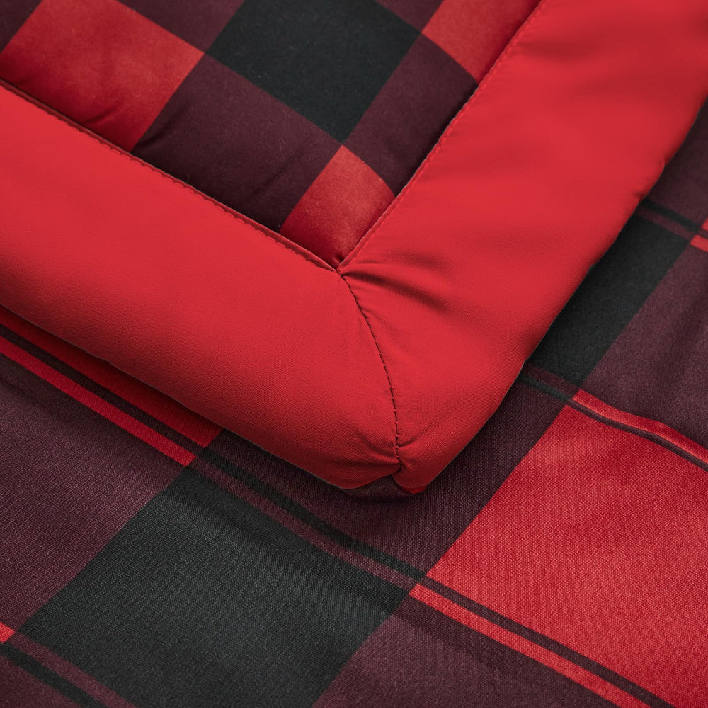 UOZZI BEDDING red and black holiday color scheme complements most nurseries.
