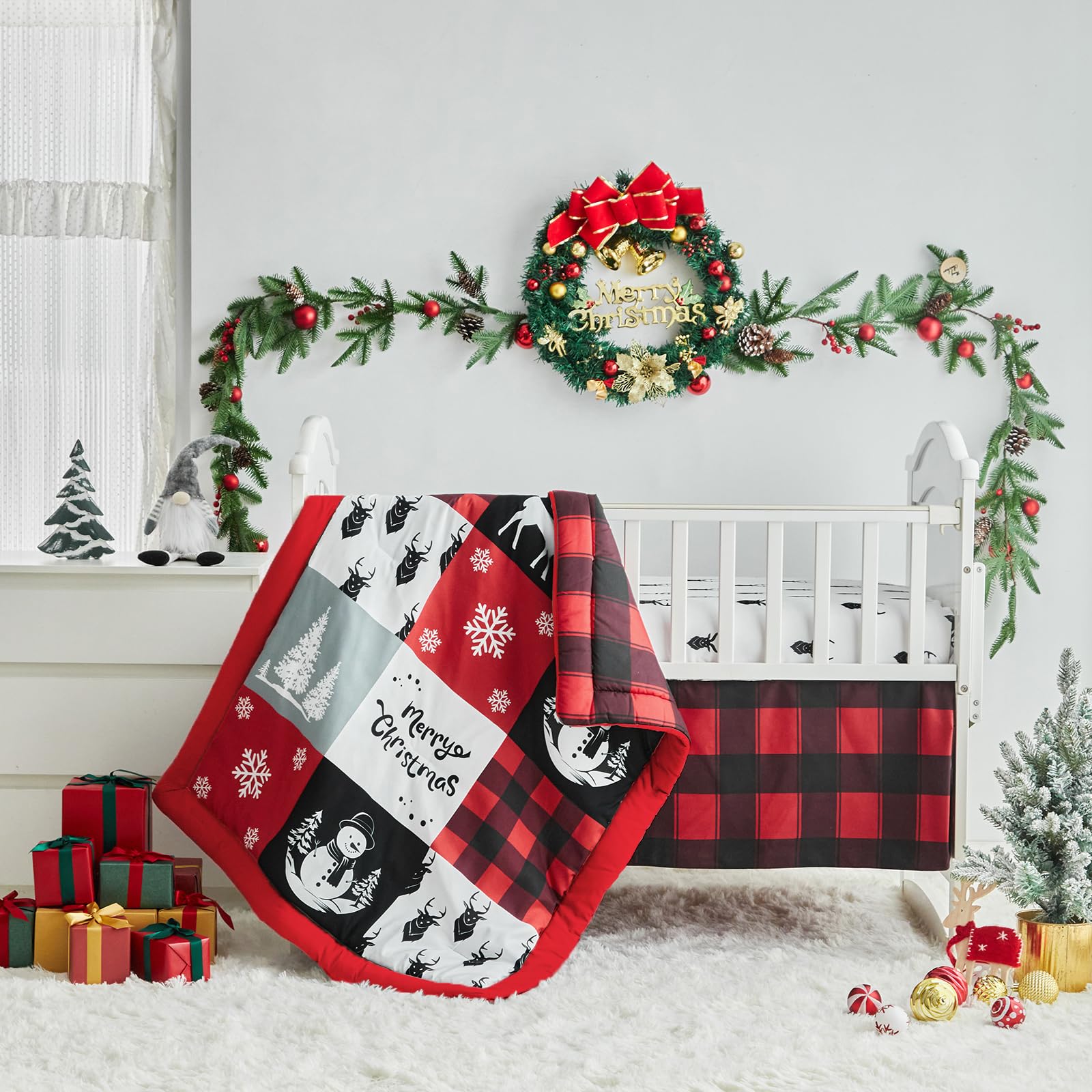UOZZI BEDDING snowman motif in red and black adds festive style to the crib.