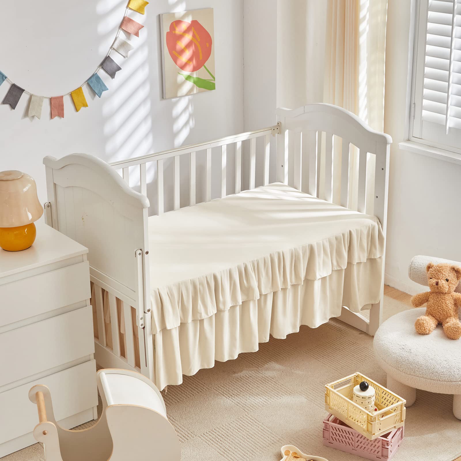 UOZZI BEDDING crib skirt 28x52 fits for a neat finish.