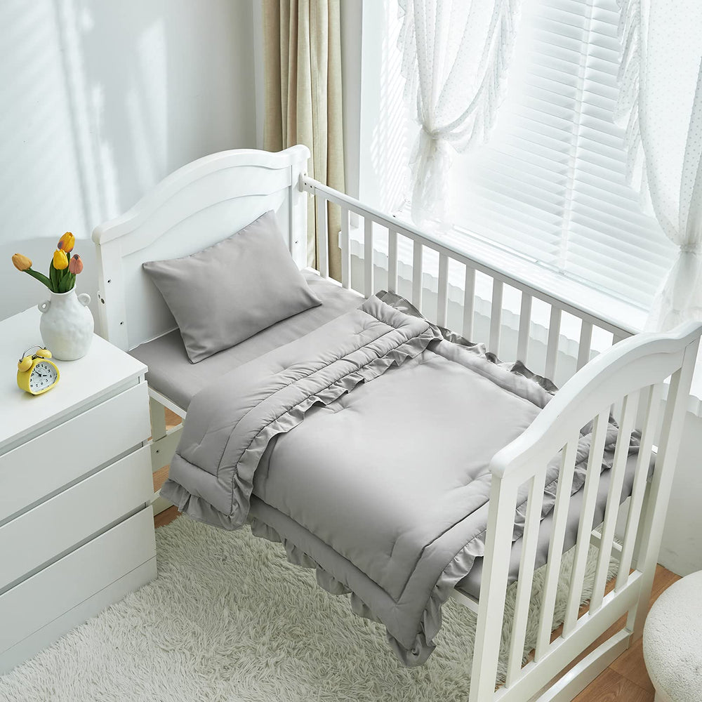 UOZZI BEDDING fitted crib sheet secures standard mattress and keeps bedding neat