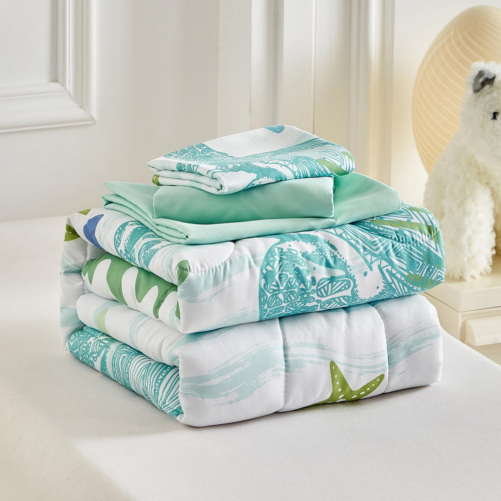 Deep navy sheets from UOZZI BEDDING sea turtle set highlight the theme.