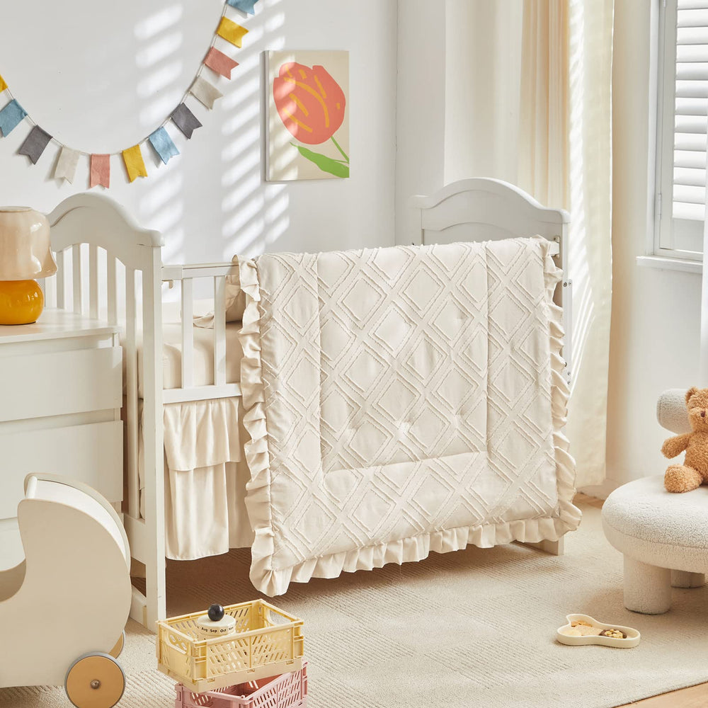 UOZZI BEDDING tufted ruffle crib comforter adds cozy charm to nursery.