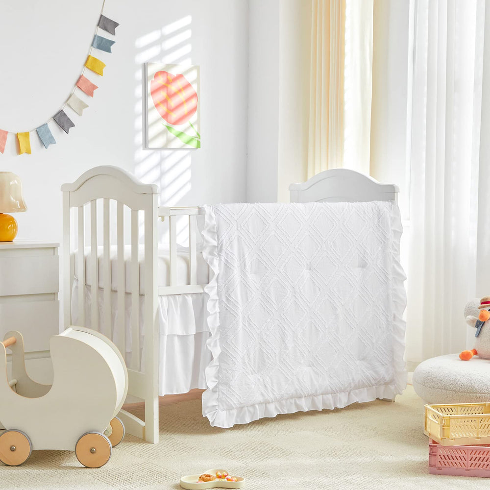 UOZZI BEDDING tufted ruffle crib comforter close-up showing soft, cozy texture