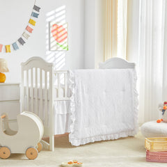 UOZZI BEDDING tufted ruffle crib comforter close-up showing soft, cozy texture