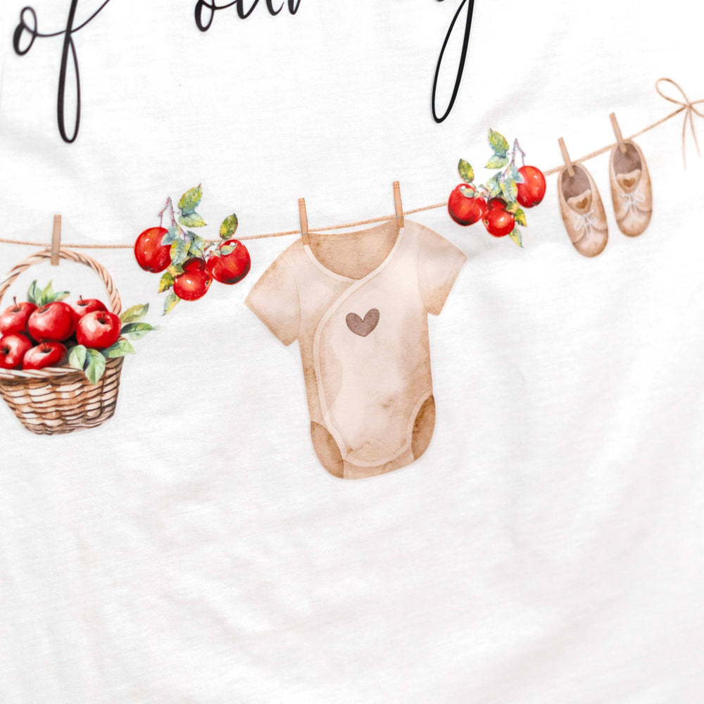 Upfirst apple basket illustration decor adds festive touch to walls and tables.