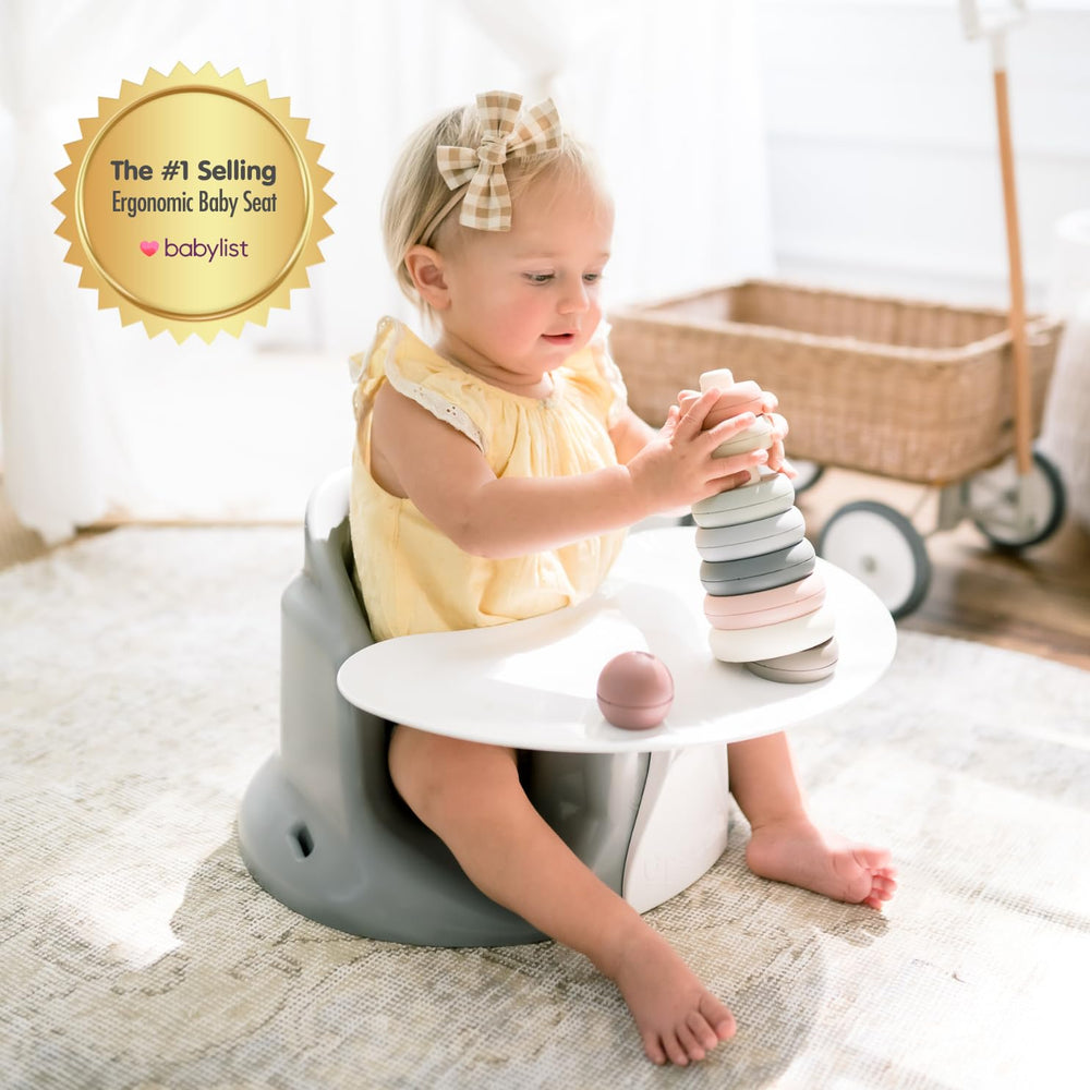 Upseat booster with tray keeps meals at comfortable height.