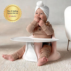 Upseat booster seat with tray converts to a high chair for meals.