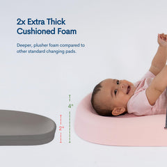 Upseat changing pad contoured for comfort supports baby's body during changes.