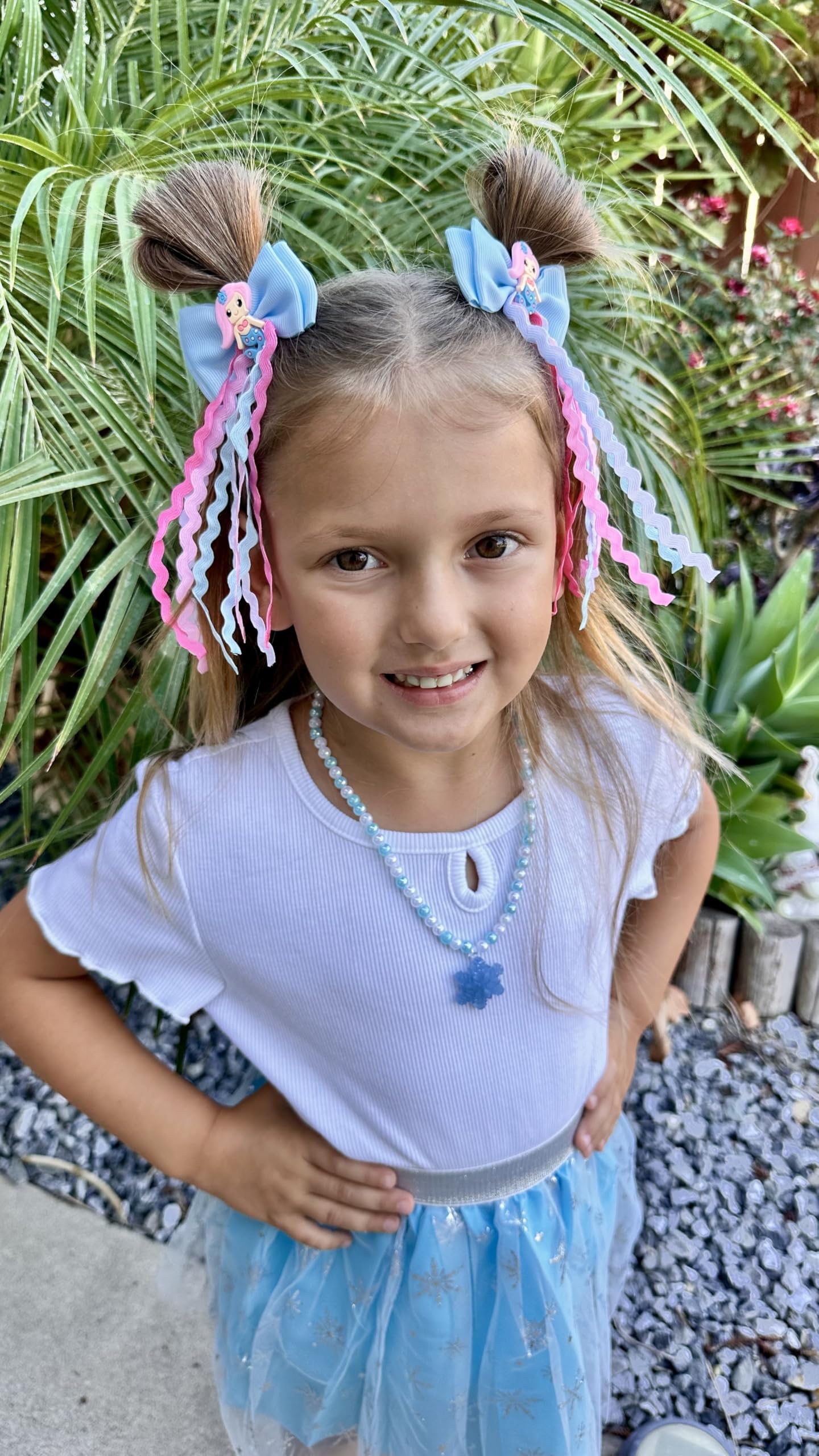 Usakinon Mermaid Bows with wavy streamers add movement.