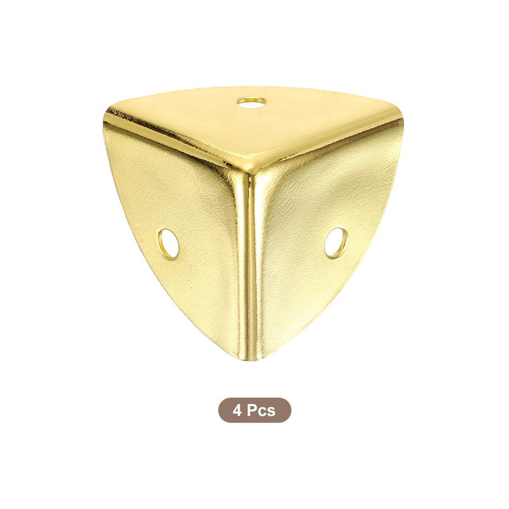 uxcell gold corner protector installed on a wooden case to shield edges