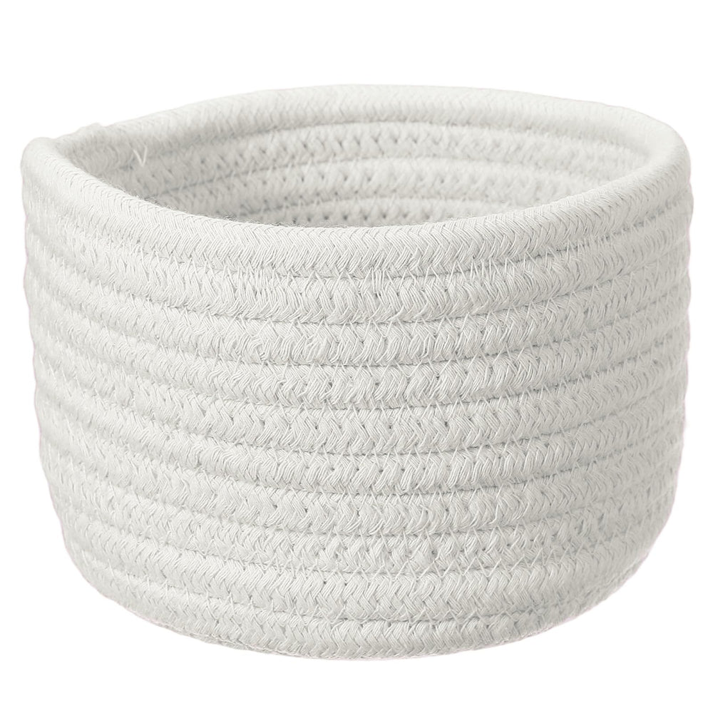 uxcell white cotton rope storage basket on a desk keeps small items organized.
