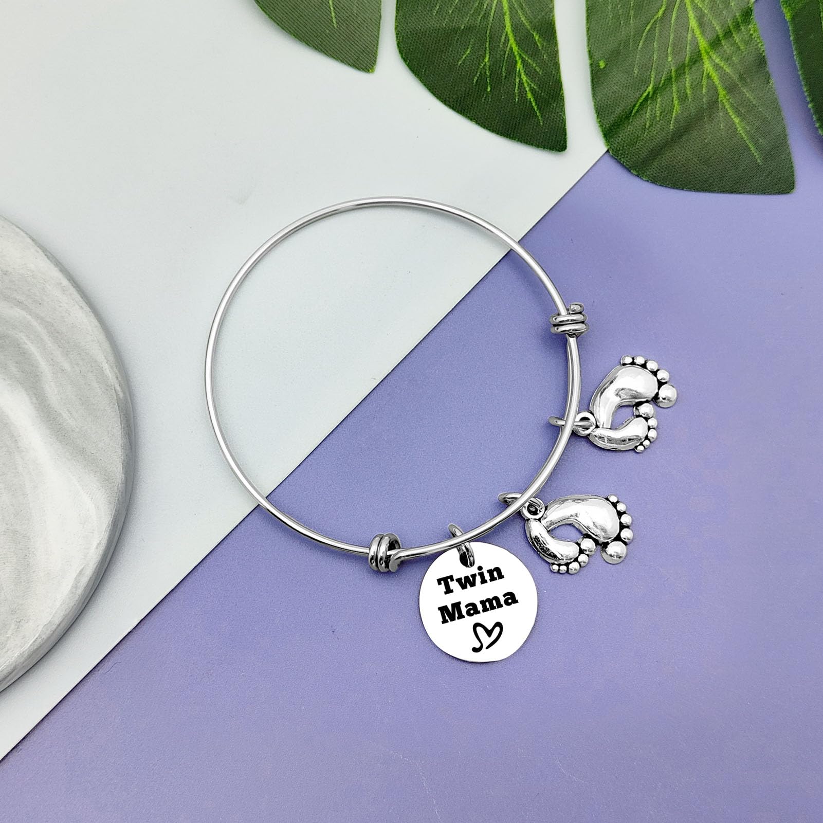 Vadaka Twins Mama Jewelry used for pregnancy or gender reveal moment.