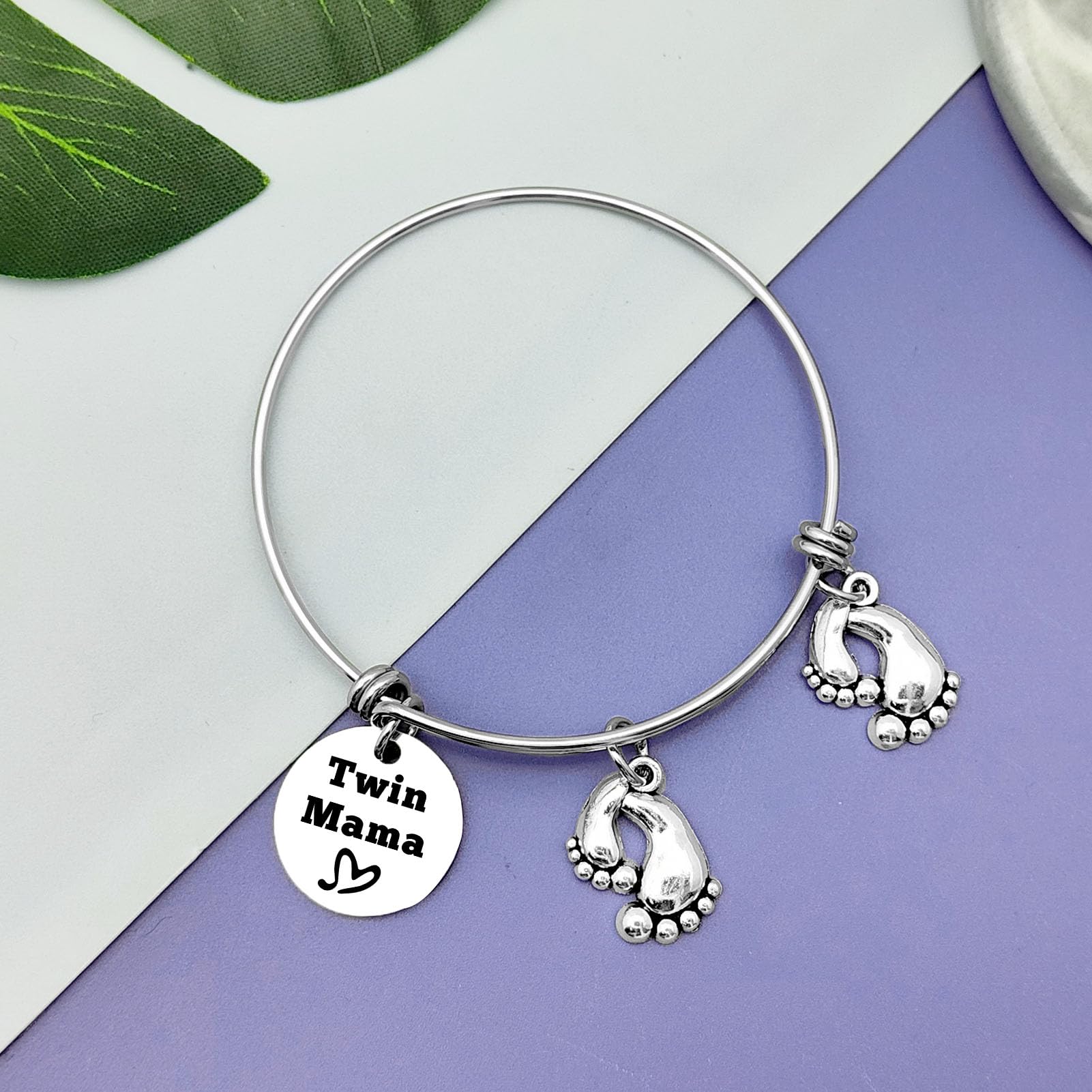 Closeup of Vadaka Twins Mama Jewelry design, delicate stainless steel.