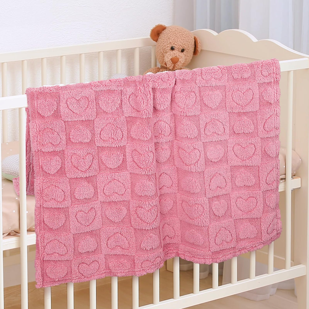 VEIDIA heart-checkered blanket enhances nursery decor with a warm, inviting vibe.