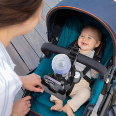 Vekniqo stroller phone holder demonstrates 2-in-1 design for calls and drinks.