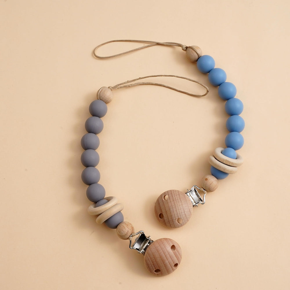 Verxcty pacifier clip with natural wood ring in blue for easy reach