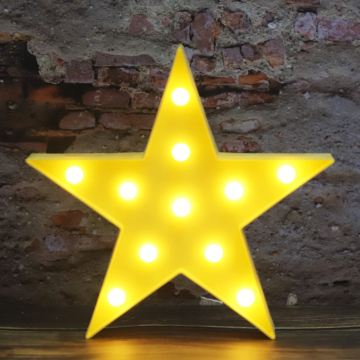 Vicila LED marquee star light glows softly to brighten a child's nursery.