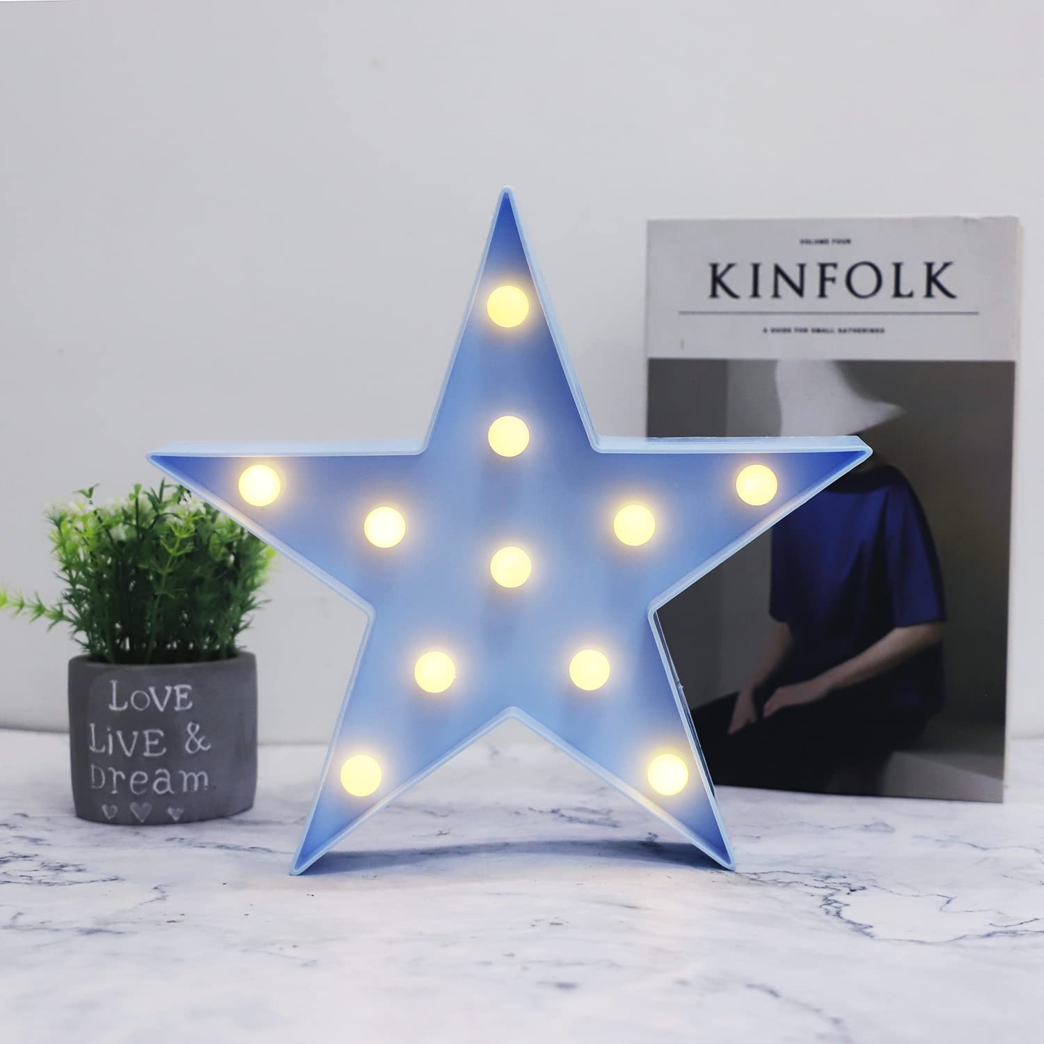 Vicila LED marquee star night light on table provides gentle bedside glow