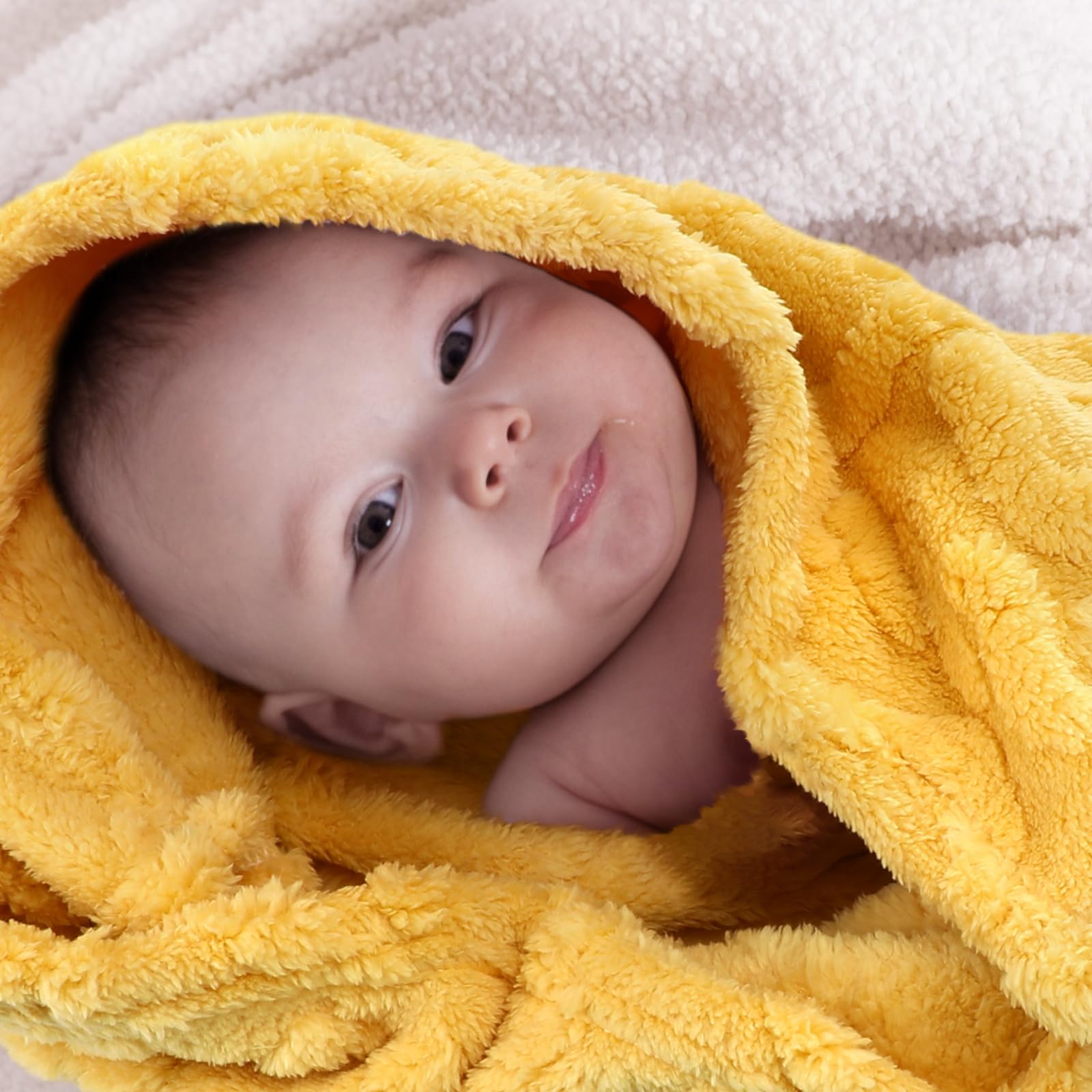 VitalCozy orange set blankets rolled in nursery, simple organization