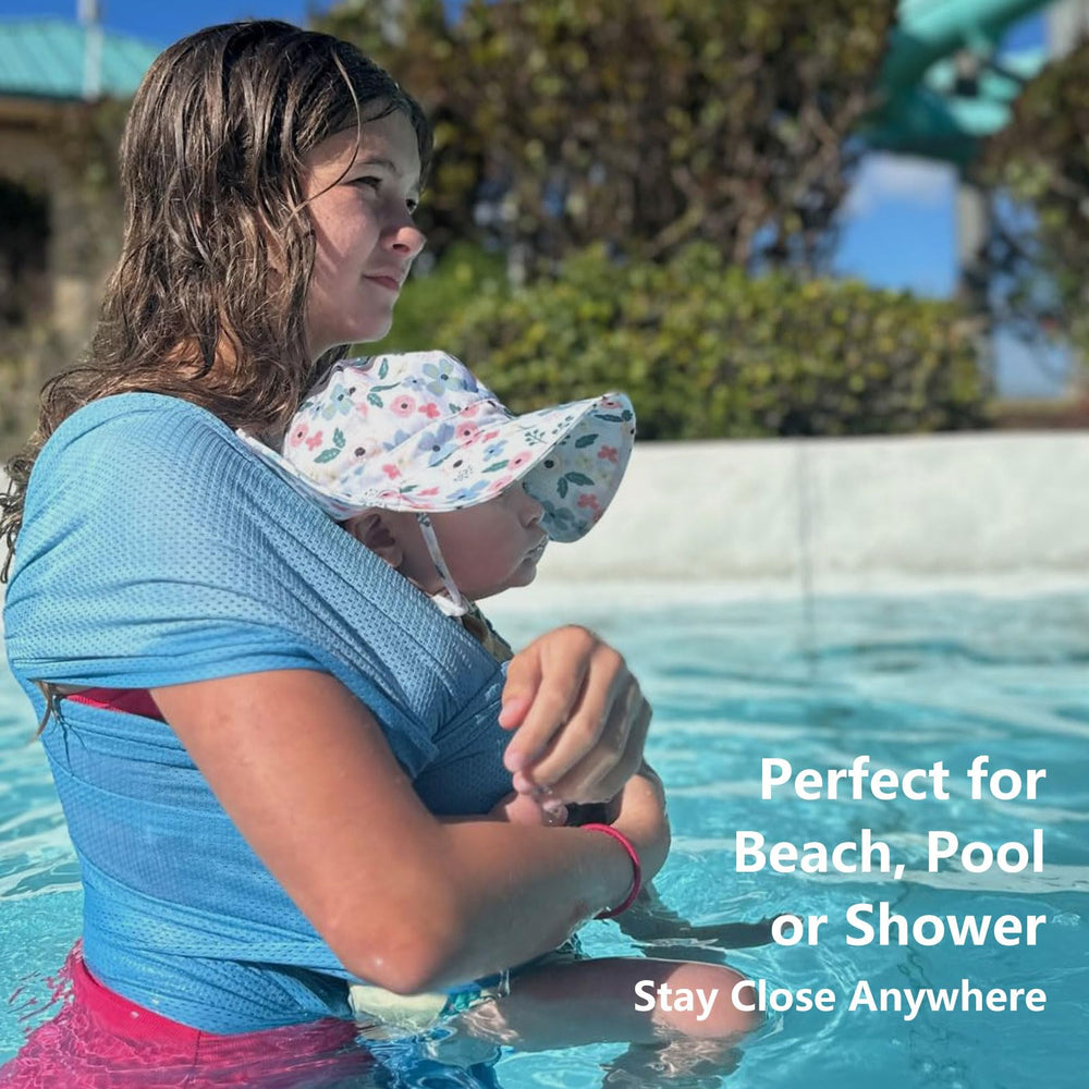Vlokup baby wrap sling at the beach for easy toddler rides.