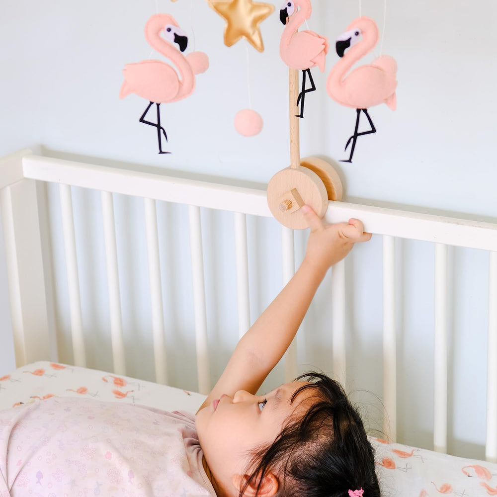 Vlokup pink flamingo ceiling mobile brightens spaces above cribs and bassinets.