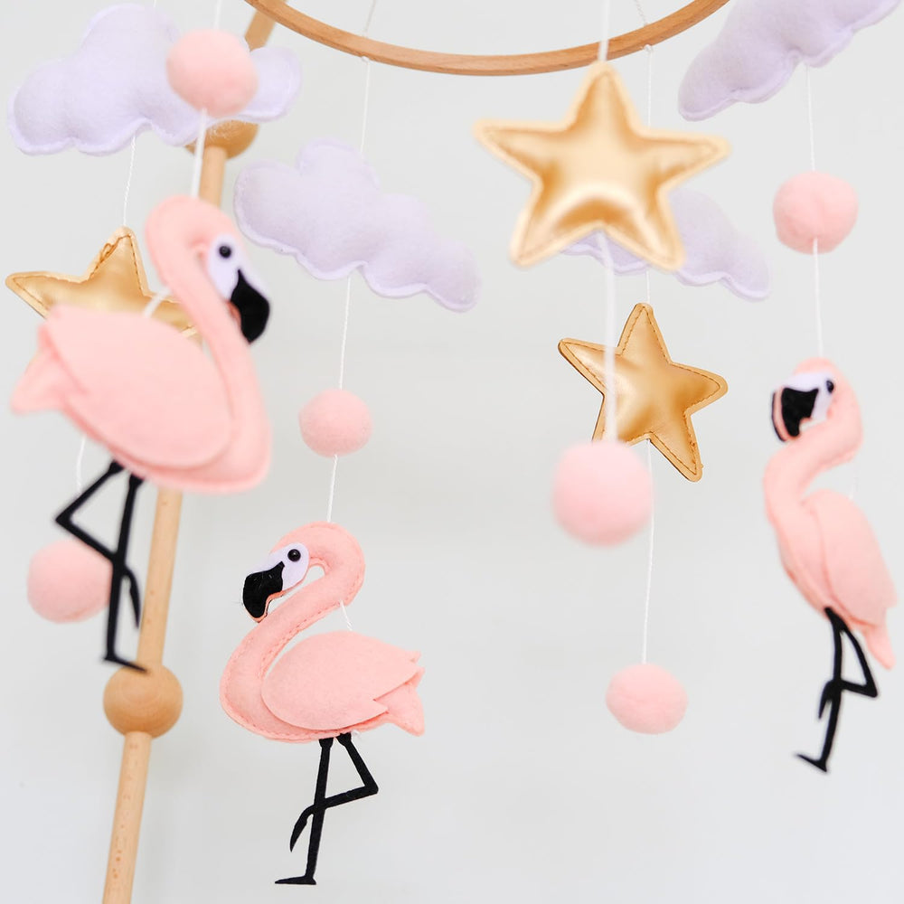 Vlokup flamingo ceiling-mobile setup works with standard cribs.