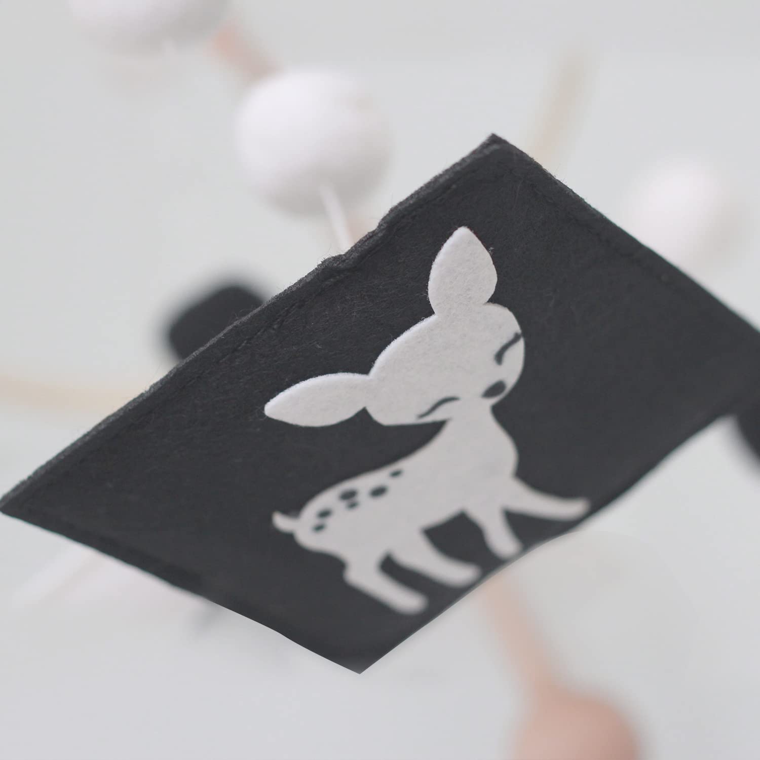 Vlokup woodland mobile as a nursery decor prop for photos and ambience
