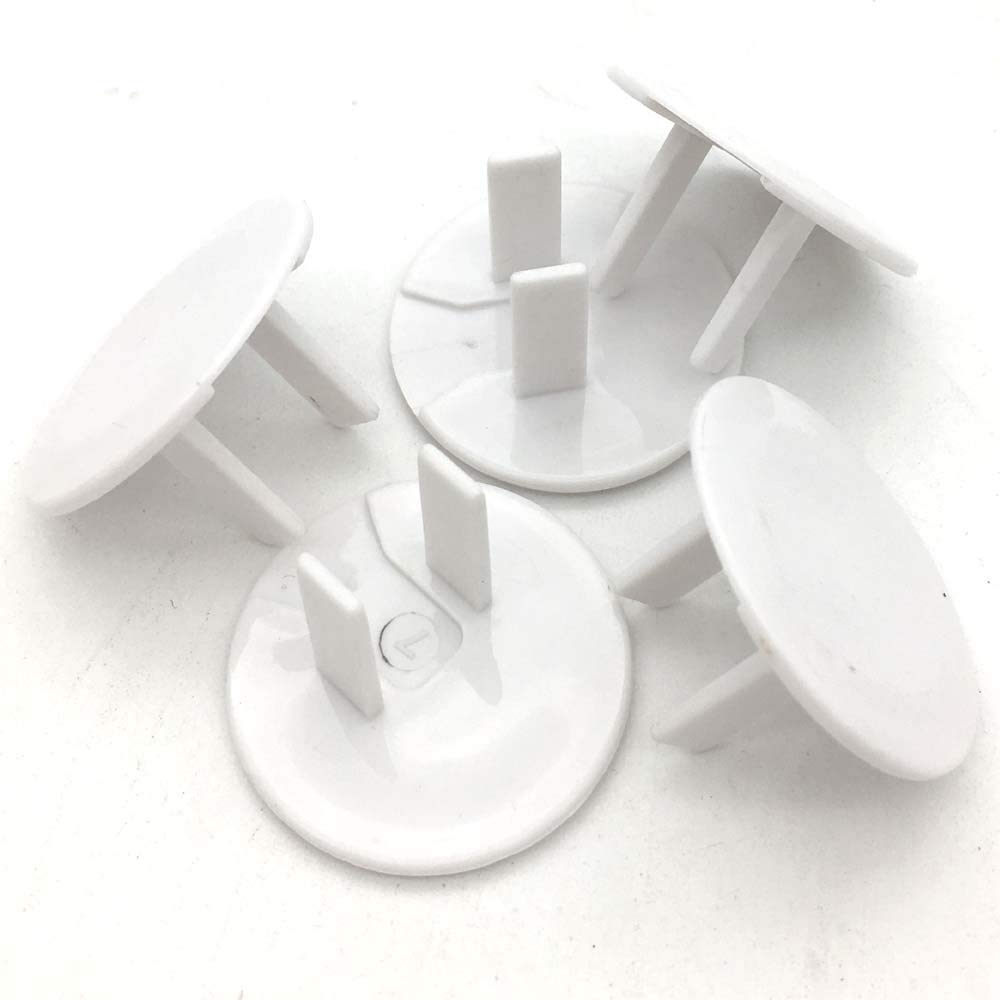 Close-up of Vmaisi round-plug outlet covers highlights a simple, secure design.