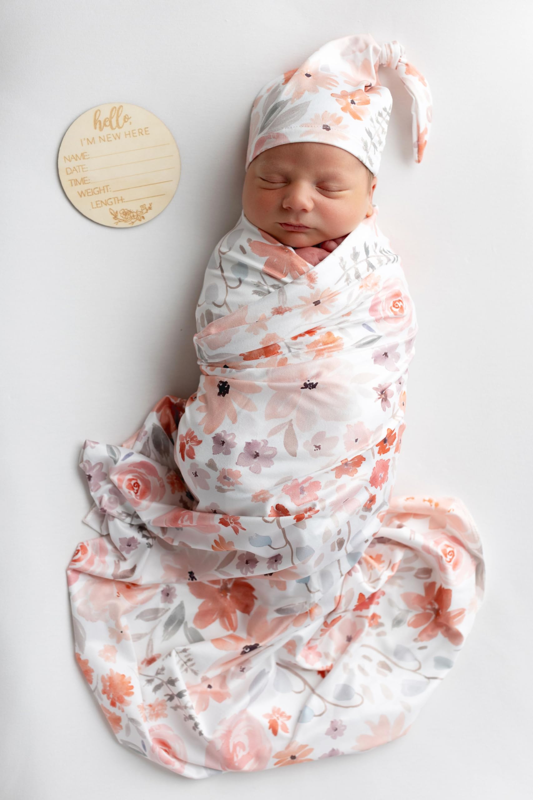 Vollmic newborn swaddle orange front view shows soft, breathable knit fabric.