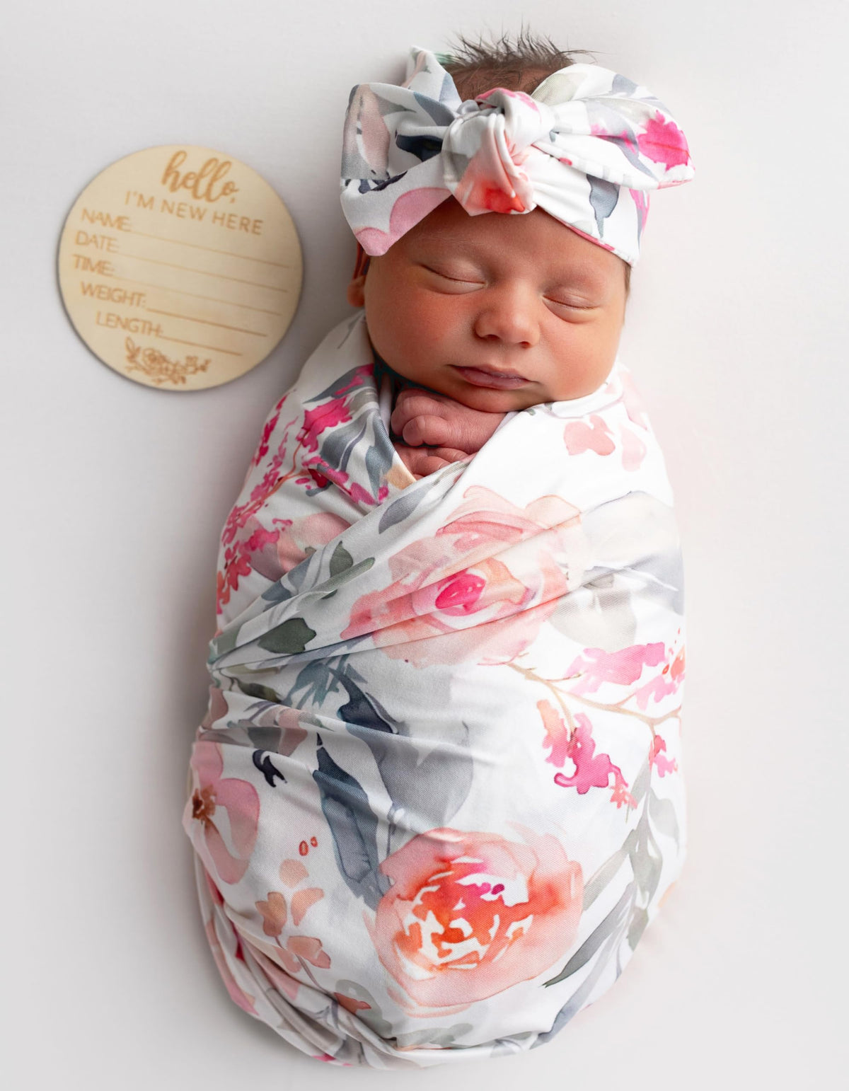 Vollmic newborn swaddle fabric close-up in pink floral leaf knit.