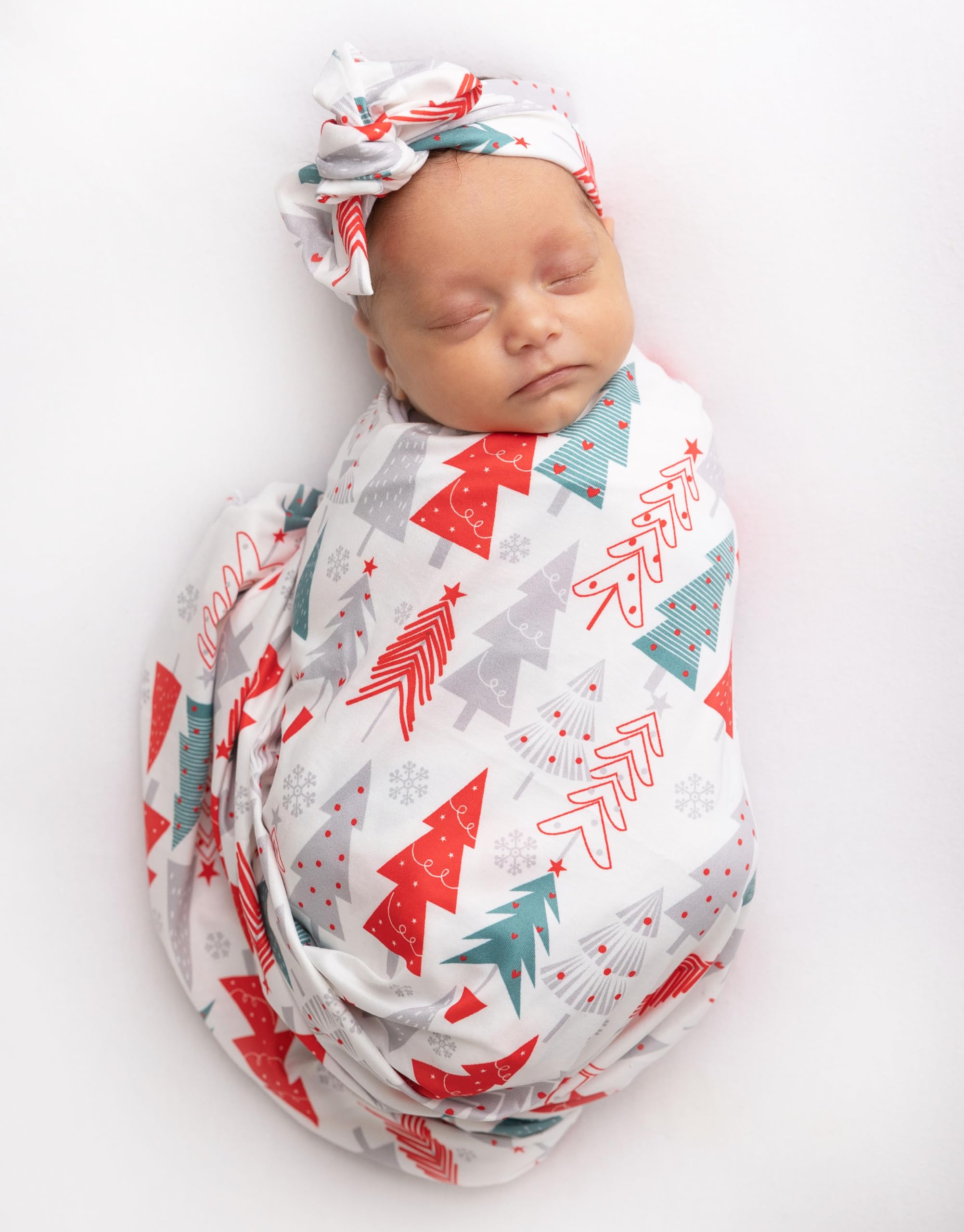 Vollmic newborn swaddle in red tree pattern laid flat for a cozy look.