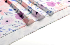 Vollmic swaddle blanket features serged edging for durability.