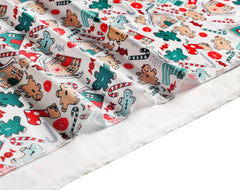 Vollmic swaddle blanket flat lay with green cartoon Christmas design and beanie