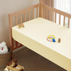 Vonty fitted crib sheet with elastic edge securing a snug 52x28 fit.