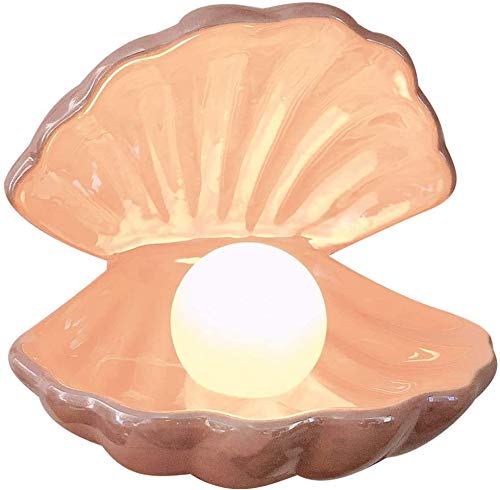 Vosarea shell pearl night light pink on bedside table with soft glow