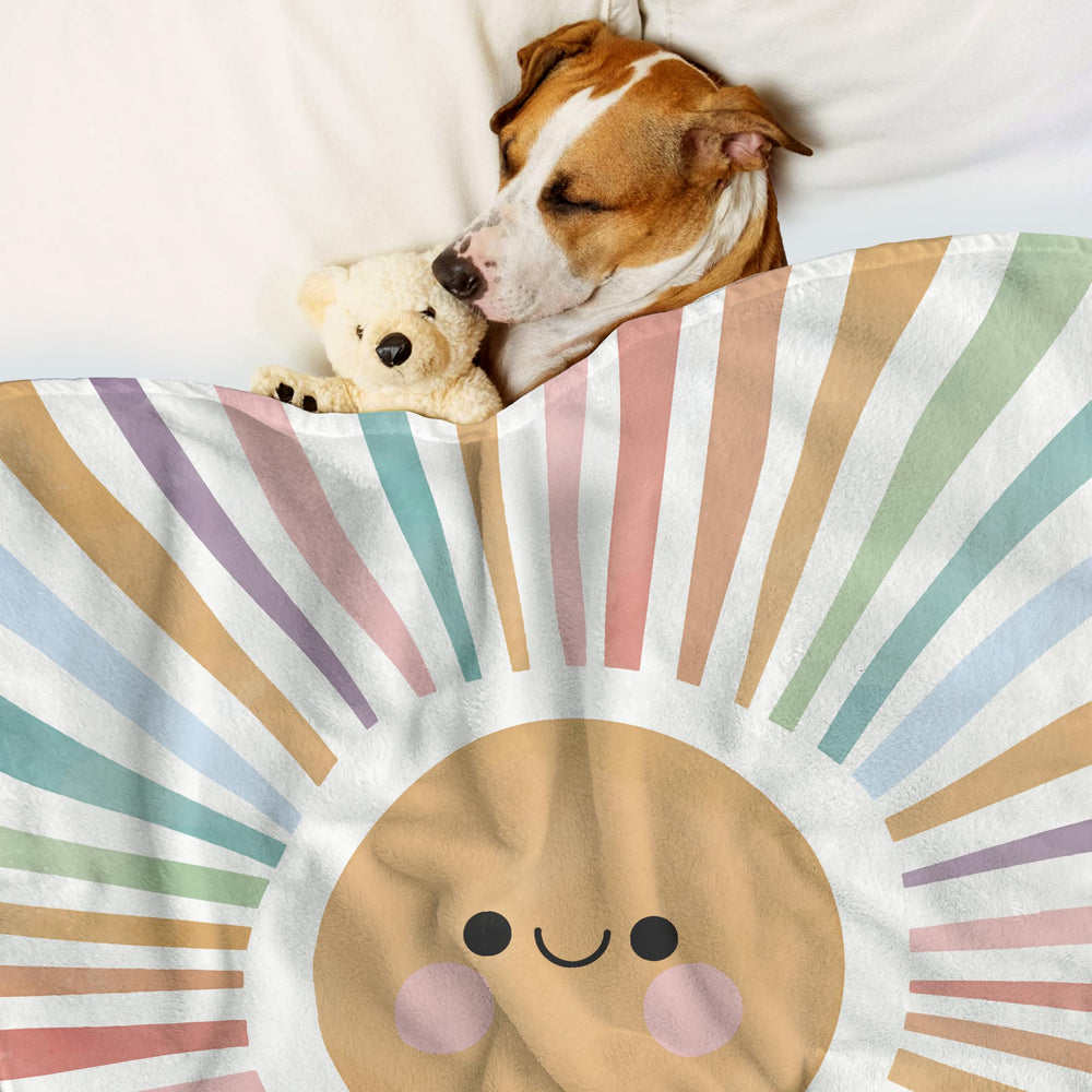 VRW décor blanket with sun motif brightens play areas and cuddle spaces.
