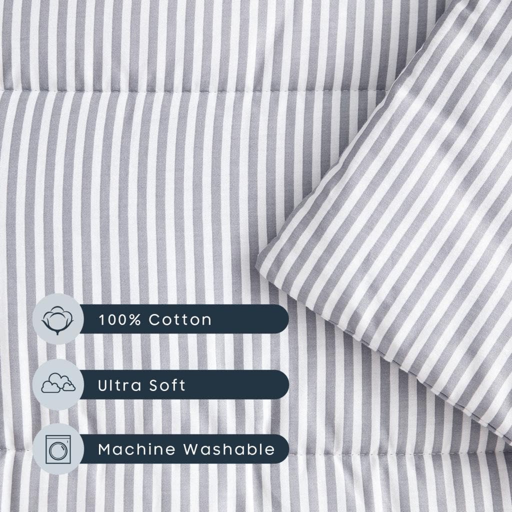 Wake In Cloud gray striped nap mat on white fabric for stylish naptime.