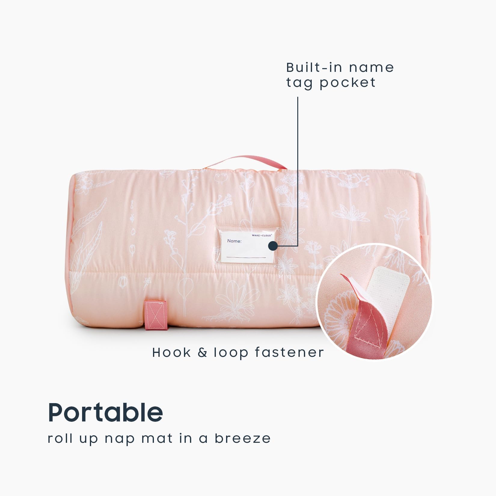 Wake In Cloud roll-up nap mat with a handle for on-the-go use.