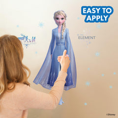 Elsa flowing cape and snowflakes wall decal creates a wintry centerpiece.